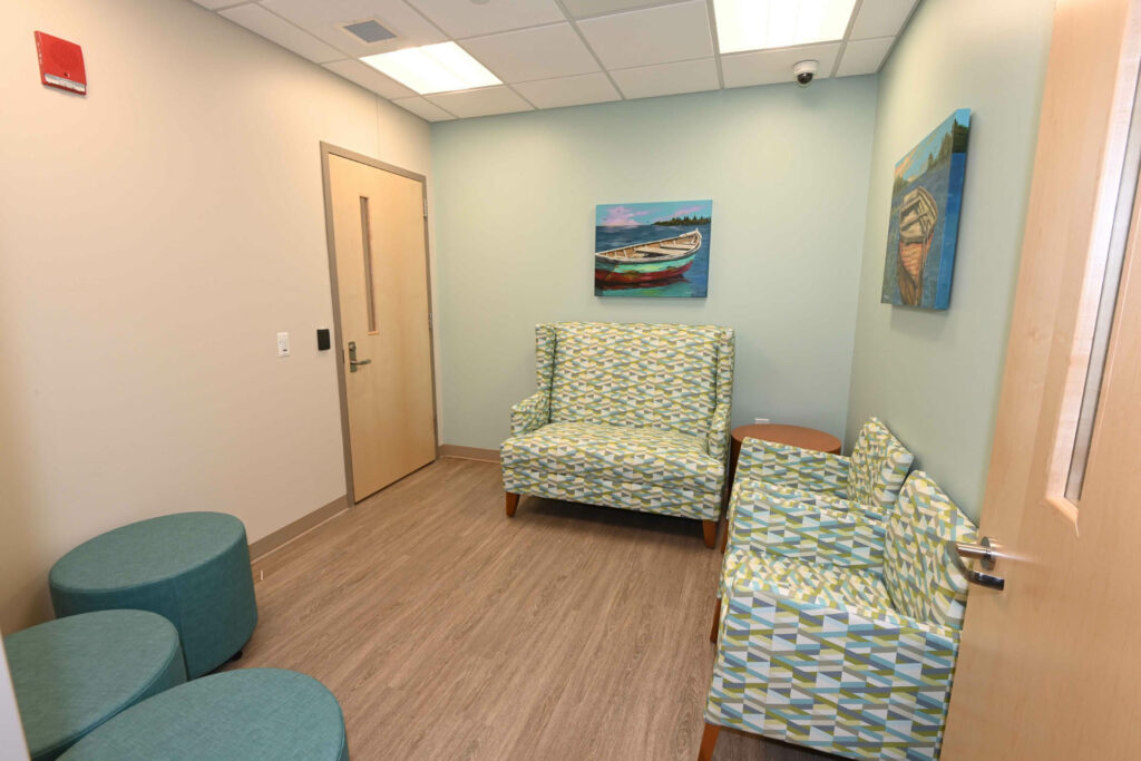 Healthcare office lobby with chairs and loveseat